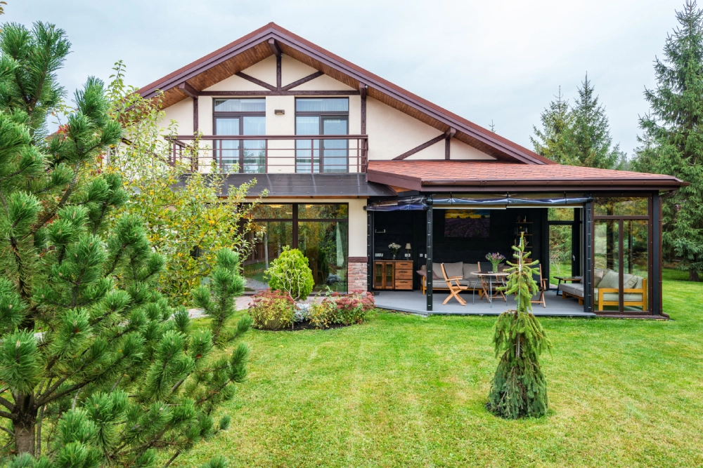 Maintained backyard lawn and garden surrounding a residential home.