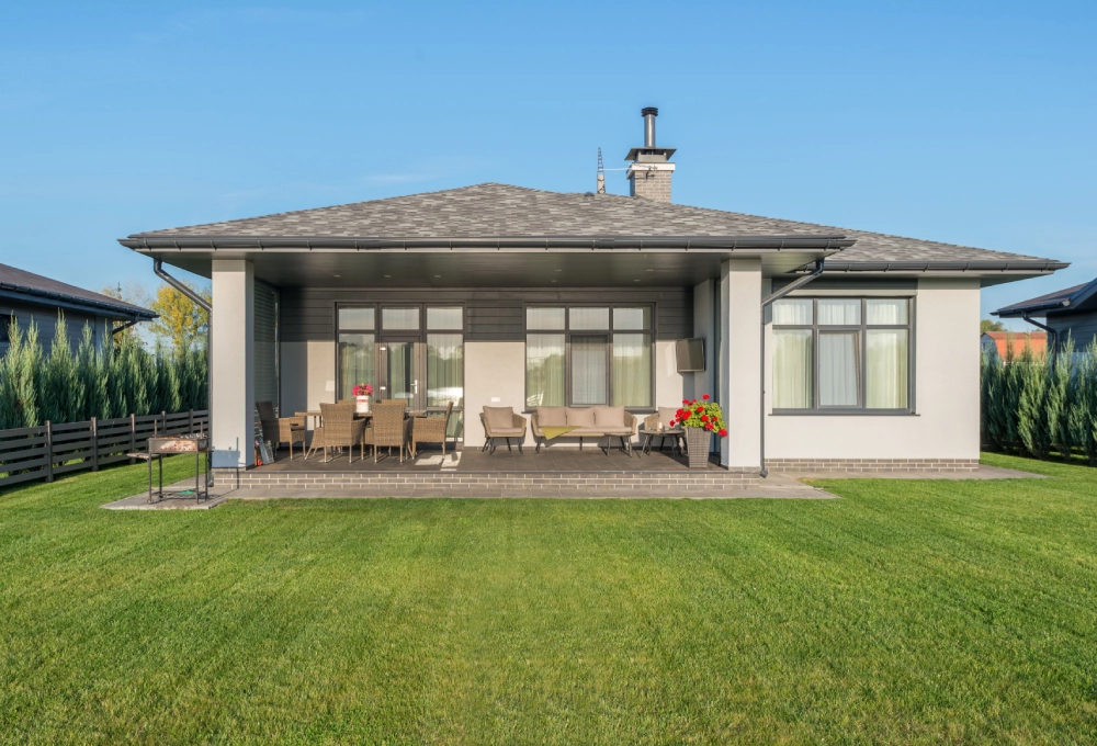 Freshly maintained lawn in the backyard of a modern home.